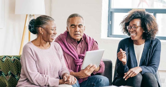 A couple reviewing a document with an attorney