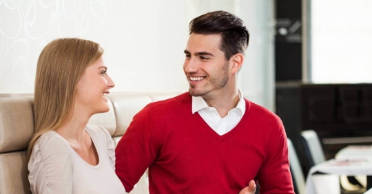 A man and woman having a friendly conversation